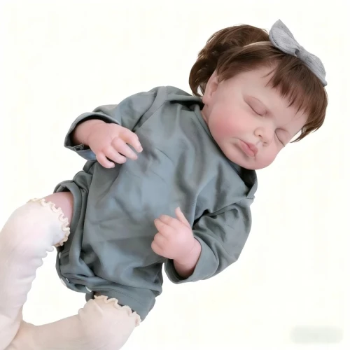 Śpiąca lalka Reborn 49 cm jak prawdziwe niemowlę w zielonym ubranku z opaską